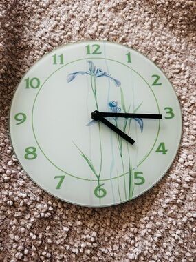 Wall Clock with Green Accents and Floral Design
